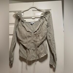 Celebrity Pink Peplum long sleeve top with ruched tie-front